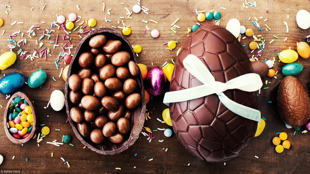 Beautiful creative photo with Chocolate Easter eggs on wooden background. Happy Easter!